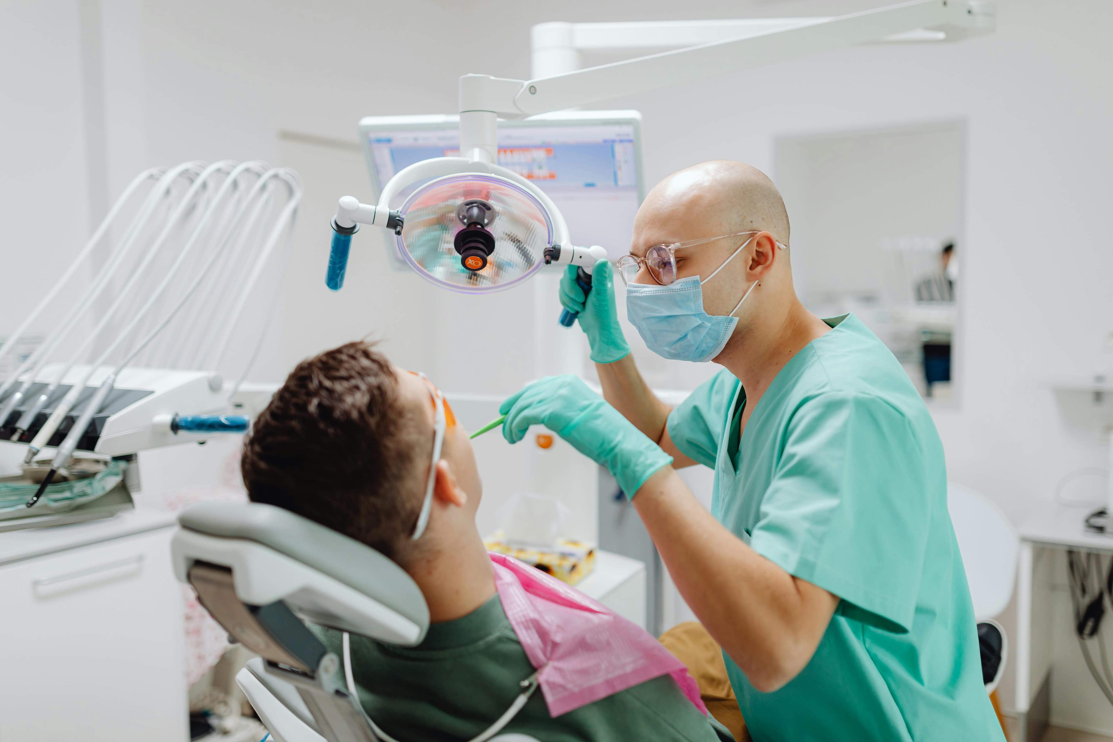 Smiling patient with dentist